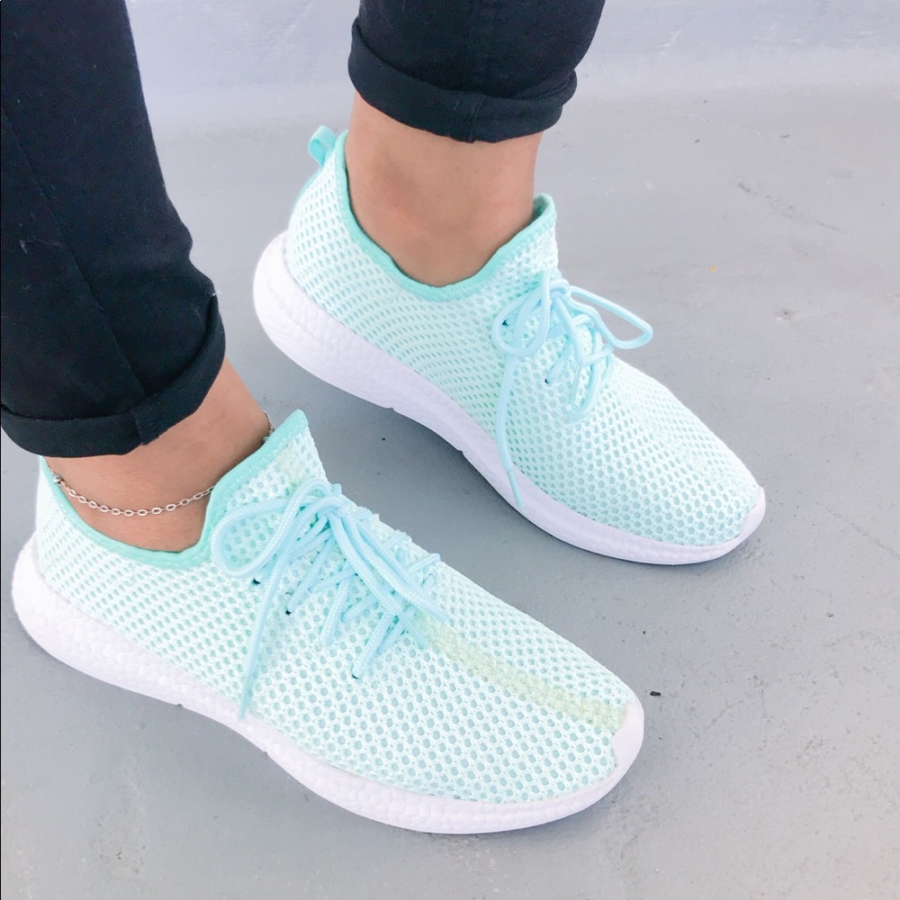 Ladies pull on light weight lace sneakers. Teal